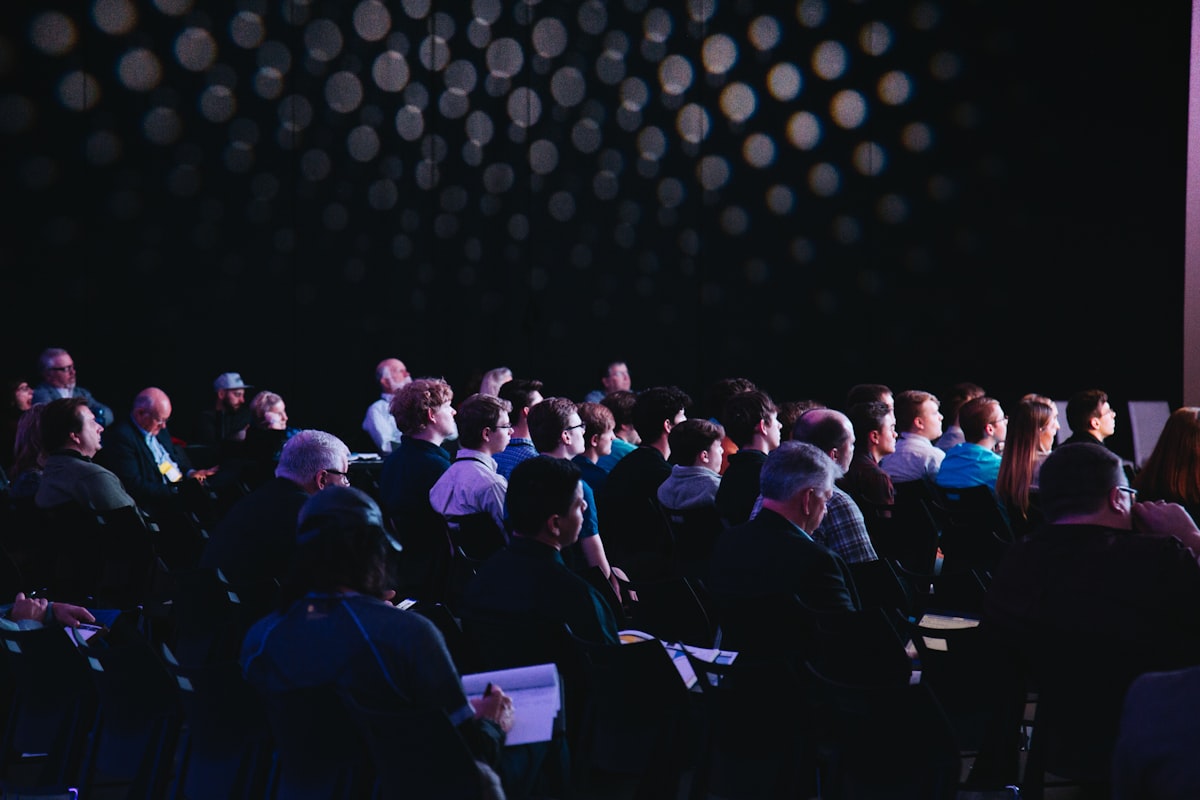 Large crowd of professionals at a conference